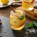 Brazilian Mounjaro recipe with apple cider vinegar served in a mason jar with lemon and ginger